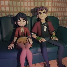 Vella and William sitting on a couch.